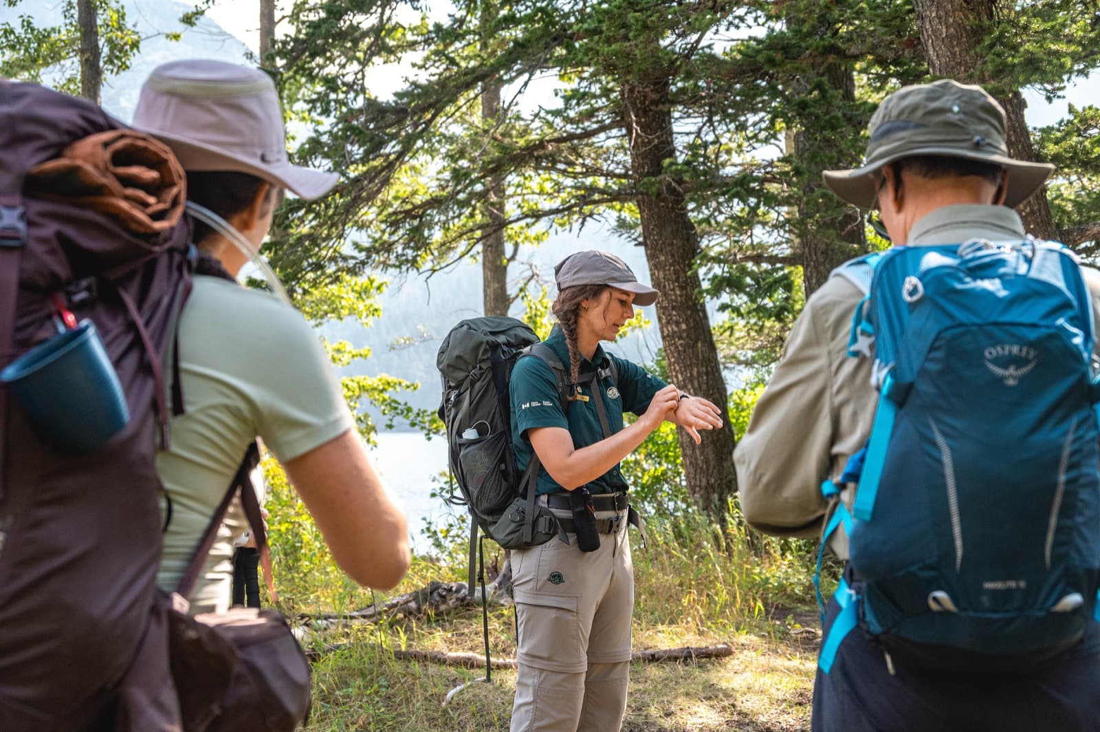 A Third Pole Adventures guide sharing a moment with travelers in the mountains