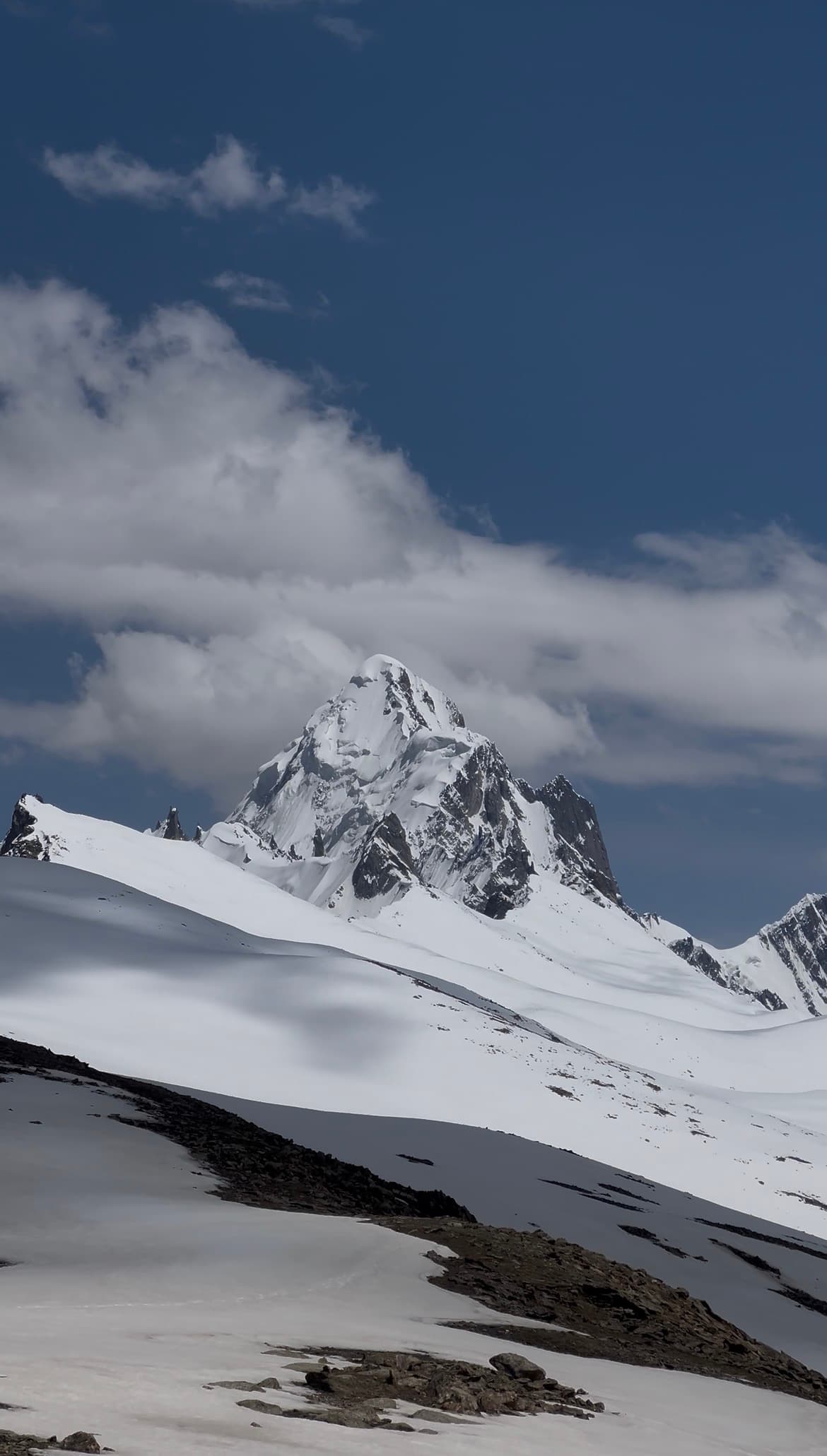 Snow-capped Karakoram peaks above a mountain valley